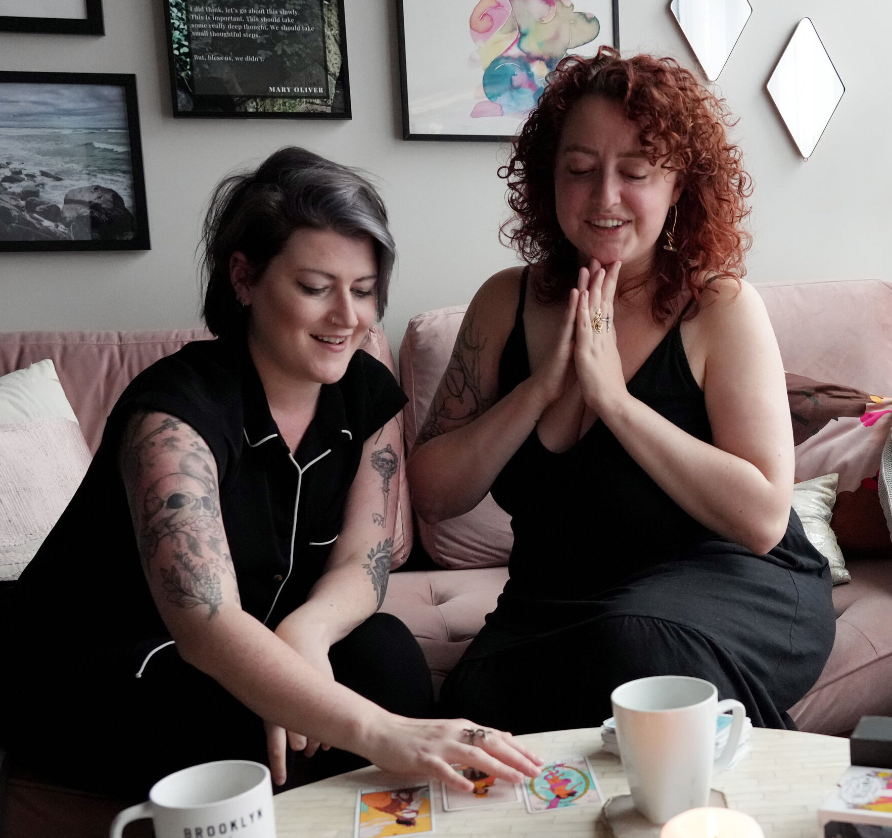 meg and jeanna read tarot cards together in their home. photo by michelle agins for the new york times